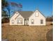 Charming single-story home with a well-maintained lawn and inviting front entrance at 609 Alyssa Ct, Locust Grove, GA 30248