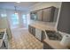 Bright kitchen with ample cabinet space, modern appliances, and a cozy breakfast nook nearby at 609 Alyssa Ct, Locust Grove, GA 30248