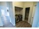 Well lit laundry room shows side-by-side stainless steel washer and dryer set at 609 Alyssa Ct, Locust Grove, GA 30248