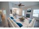 Inviting living room with a comfortable sofa, fireplace, and seamless transition to the dining area at 609 Alyssa Ct, Locust Grove, GA 30248