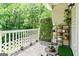 Charming balcony with potted plants, a decorative privacy screen and outdoor accents at 512 Las Brasis Ct, Peachtree City, GA 30269