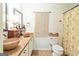 Stylish bathroom featuring vessel sinks, a macrame wall hanging, and modern fixtures at 512 Las Brasis Ct, Peachtree City, GA 30269
