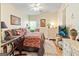 Cozy bedroom with a comfortable bed, TV, and warm decorative touches at 512 Las Brasis Ct, Peachtree City, GA 30269