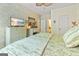 Inviting bedroom with a TV, a decorative fireplace, and serene decor for a relaxed atmosphere at 512 Las Brasis Ct, Peachtree City, GA 30269