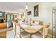 Open-concept dining room with an adjacent living room and fireplace, providing a seamless flow at 512 Las Brasis Ct, Peachtree City, GA 30269