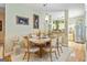 Cozy dining room with a wooden table, carpet, and an open view into the kitchen at 512 Las Brasis Ct, Peachtree City, GA 30269