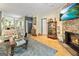 Spacious living room with fireplace and open access to the dining and kitchen areas at 512 Las Brasis Ct, Peachtree City, GA 30269