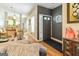 Open-concept living area with hardwood floors, dining space and a view of the kitchen at 512 Las Brasis Ct, Peachtree City, GA 30269