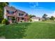 Charming brick house with a well-maintained lawn and a welcoming front porch at 419 Tea Rose N Ln, Stockbridge, GA 30281