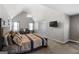 Spacious main bedroom with a vaulted ceiling, offering a cozy sitting area and a calming color scheme at 419 Tea Rose N Ln, Stockbridge, GA 30281
