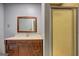 Bathroom with a vanity, mirror, and a shower with a frosted glass door at 2742 Highway 20 W, Hampton, GA 30228