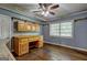 Bonus room features hardwood floors, a ceiling fan, and built-in storage at 2742 Highway 20 W, Hampton, GA 30228