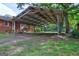 Carport with metal roof adjacent to home at 2742 Highway 20 W, Hampton, GA 30228