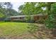 Beautiful one-story brick home with manicured lawn and mature landscaping at 2742 Highway 20 W, Hampton, GA 30228