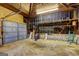 Large garage with unfinished walls features stone accents at 2742 Highway 20 W, Hampton, GA 30228