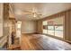 Cozy living room with unique stone fireplace and hardwood floors at 2742 Highway 20 W, Hampton, GA 30228