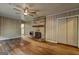 Living room features a stone fireplace, ceiling fan and access to other areas of the home at 2742 Highway 20 W, Hampton, GA 30228