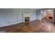 Spacious living room features a fireplace and gleaming hardwood floors at 2742 Highway 20 W, Hampton, GA 30228
