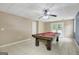 Spacious finished basement features a pool table and tile flooring at 70 N Strathmore Dr, Sharpsburg, GA 30277