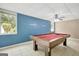Basement with a pool table, tile floors, neutral paint, and natural light at 70 N Strathmore Dr, Sharpsburg, GA 30277