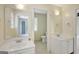 Bright bathroom features dual vanities, tile floors, and neutral wall colors at 70 N Strathmore Dr, Sharpsburg, GA 30277