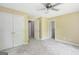 Spacious bedroom featuring carpet and a closet with double doors at 70 N Strathmore Dr, Sharpsburg, GA 30277