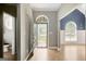 Inviting foyer features hardwood floors, gray walls and provides an entryway into the home at 70 N Strathmore Dr, Sharpsburg, GA 30277