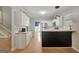 Updated kitchen features white cabinets and stainless steel appliances at 70 N Strathmore Dr, Sharpsburg, GA 30277