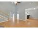 Spacious living room featuring light wood floors and an open floor plan at 70 N Strathmore Dr, Sharpsburg, GA 30277