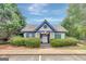 Community pool house framed by lush greenery and a clear blue sky at 70 N Strathmore Dr, Sharpsburg, GA 30277