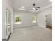 Spacious bedroom with tray ceiling, carpet floors and natural light at 4585 Parkwood Rd, Social Circle, GA 30025
