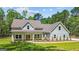 Charming craftsman-style home with a welcoming front porch and beautifully landscaped yard at 4585 Parkwood Rd, Social Circle, GA 30025