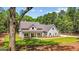 Attractive two-story home featuring a covered front porch and a well-manicured front lawn at 4585 Parkwood Rd, Social Circle, GA 30025