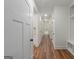 Bright hallway with wood floors at 4585 Parkwood Rd, Social Circle, GA 30025
