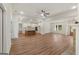 An open-concept home shows a cozy living area connected to a spacious, modern kitchen at 4585 Parkwood Rd, Social Circle, GA 30025