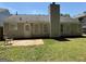 Large backyard with a patio, lawn and mature trees perfect for outdoor living and relaxation at 6372 Stonebridge Creek Ln, Lithonia, GA 30058