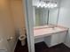 Functional bathroom featuring a toilet, vanity, and mirror at 6372 Stonebridge Creek Ln, Lithonia, GA 30058