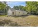 View of backyard, showing the yard, the fence line and the back of the house at 1834 Stroud Road, Mcdonough, GA 30252