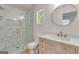 Bathroom featuring a glass enclosed shower, modern vanity, and stylish fixtures at 1834 Stroud Road, Mcdonough, GA 30252