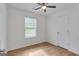 This comfortable bedroom has wood-look floors, a ceiling fan and a window for ample sunlight at 1834 Stroud Road, Mcdonough, GA 30252