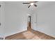 Bright bedroom features a ceiling fan, wood-look flooring, and a neutral color palette at 1834 Stroud Road, Mcdonough, GA 30252