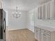 This dining room is well-lit with an interesting light fixture and a good view at 1834 Stroud Road, Mcdonough, GA 30252