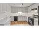 Bright kitchen features modern appliances, ample counter space, and wood-look flooring at 1834 Stroud Road, Mcdonough, GA 30252