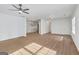 Spacious living room with wood floors and modern ceiling fan at 1834 Stroud Road, Mcdonough, GA 30252