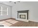Bright living room with a fireplace and large windows at 1834 Stroud Road, Mcdonough, GA 30252