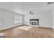 Spacious living room with a fireplace, large windows, and wood-look floors at 1834 Stroud Road, Mcdonough, GA 30252