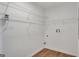 Spacious walk-in closet offers ample storage space with shelves and wood-look flooring at 1834 Stroud Road, Mcdonough, GA 30252