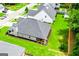 Aerial view showing the backyard, patio, and green lawn at 328 Brookstone Dr, Carrollton, GA 30116