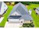 Aerial view of home highlighting the roof, garage, front yard, and green lawn at 328 Brookstone Dr, Carrollton, GA 30116