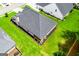 Aerial view showing the backyard, patio, and surrounding green space at 328 Brookstone Dr, Carrollton, GA 30116